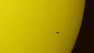 May 12 2009: The Space Shuttle Atlantis silhouetted against the sun. AP Photo/NASA