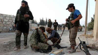 Rebel fighters prepare their weapons in an artillery academy of Aleppo, Syria, August 6, 2016. REUTERS/Ammar Abdullah