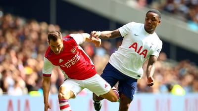Cedric Soares of Arsenal and Steven Bergeijn of Tottenham Hotspur battle for the ball.