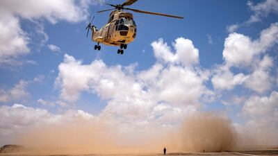 A Royal Moroccan Air Force Aerospatiale SA 330 Puma flies over during the "African Lion" military exercise in the Tan-Tan region in southwestern Morocco. AFP