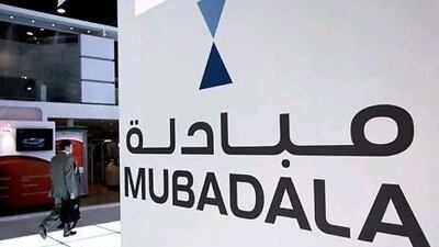 Mubadala Development, a strategic investment company owned by the Abu Dhabi Government, is among the first to benefit from an initial public offering announced yesterday by the Carlyle Group. Stephen Lock / The National