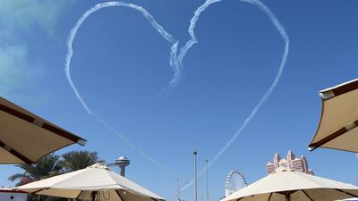 The Al Fursan National Aerobatic Team create a heart in the sky. AFP