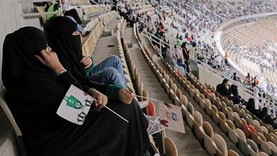 Saudi women watch the soccer match between Al-Ahli against Al-Batin at the King Abdullah Sports City in Jeddah, Saudi Arabia January 12, 2018. REUTERS/Reem Baeshen NO RESALES. NO ARCHIVES