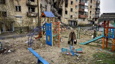 A playground near a damaged apartment block in Horenka village, Ukraine. EPA