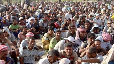 Displaced Iraqis from the city of Fallujah rest at a safe zone on June 17, 2016 after they were evacuated by Iraqi government forces due to continuing fighting to retake the city from ISIL. Moadh Al-Dulaimi / Agence France-Presse