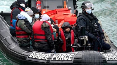 Migrants are taken to Dover, Kent, by Border Forcer officers, from a small boat found in the English Channel on January 10. PA