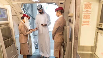 A passenger is welcomed aboard the flight