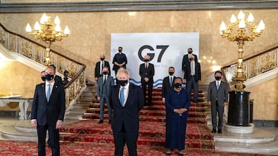 A handout picture released by the European Commission shows Britain's Prime Minister Boris Johnson and Britain's Foreign Secretary Dominic Raab posing for a family photograph with other delegates during the G7 foreign ministers meeting in London. AFP