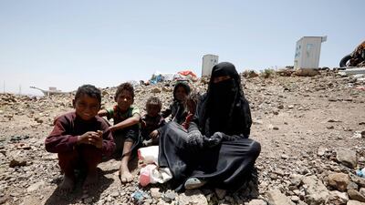 A Yemeni family sit in a camp for internally displaced persons on the outskirts of Sanaa. EPA
