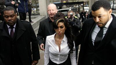 Winehouse's career was dotted with serious incidents, here she is pictured arriving for a hearing at Milton Keynes' Magistrates Court, England. AP