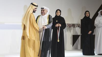 Sheikh Mohammed bin Rashid, Vice President and Ruler of Dubai, presents a medal to Ahmed Mohammed Al Mansoori. Sarah Dea / The National