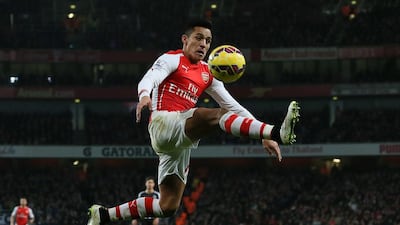 Arsenal’s Alexis Sanchez leaps to control the ball during the English Premier League match against Newcastle United at the Emirates Stadium in London on December 13, 2014. Tim Ireland / AP Photo