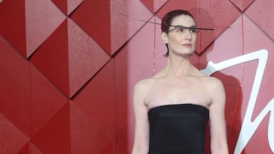 British model Erin O'Connor looks dramatic at the Fashion Awards 2023. EPA