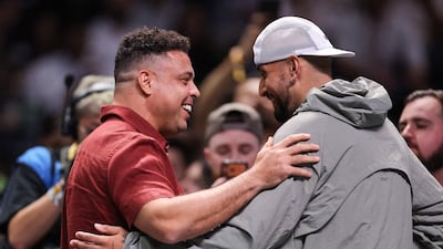 Australia's Nick Kyrgios with Brazilian footballer great Ronaldo. AFP