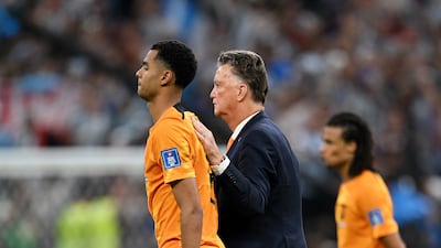Louis van Gaal, coach of Netherlands, consoles Cody Gakpo after the loss against Argentina. Getty