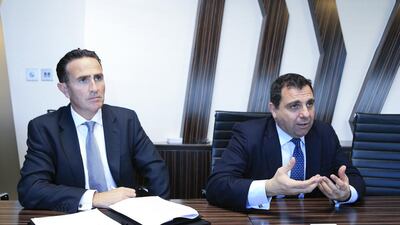 Left to right, Austin Rudman, a KPMG partner in Dubai, and Bill Michael, the regional head of financial services at KPMG in London. Sarah Dea / The National