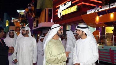 Sheikh Mohammed bin Rashid, Sheikh Hamdan and Sheikh Maktoum tour the IMG Worlds of Adventure theme park on the day of its inauguration.