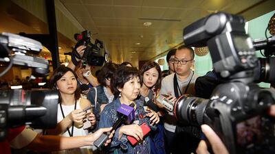 A woman leaves a holding area for friends and relatives of passengers on AirAsia flight QZ8501 at Changi Airport on Sunday in Singapore. AirAsia announced that the flight from Surabaya, Indonesia to Singapore lost contact with air traffic control this morning. Suhaimi Abdullah / Getty Images