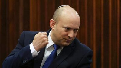 Yamina party leader Naftali Bennett gestures during a special parliament session to elect a new president on June 2, 2021. He is expected to head Israel's next coalition government. via AP