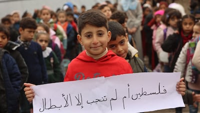 A pupil stands in line during the first day of classes at a school in Gaza city on Sunday. AFP