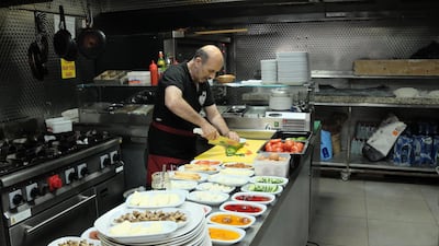 A chef prepares halloumi salads at Urfa Ocakbasi. Arthur Scott-Geddes / The National