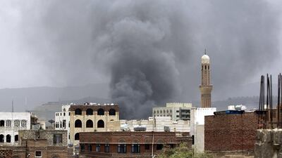 Saudi-led coalition carried out airstrikes on a Houthi-controlled security base, which included a military depot, in the Yemeni capital Sanaa yesterday, killing dozens and injuring nearly 100 people. Yahya Arhab / EPA