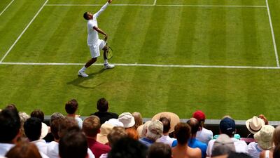 Nick Kyrgios serves during his Wimbledon 2015 first round win over Diego Schwartzman on Monday during the tournament's opening day in London. Clive Brunskill / Getty Images