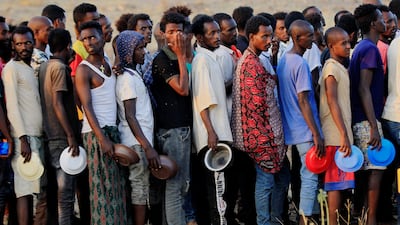 Ethiopians who fled war in the Tigray region queue for food rations at a refugee camp in Al Qadarif state, Sudan. Photo: Reuters