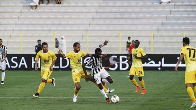 Al Jazira’s Jonathan Pitroipa, second from left, eludes the Al Wasl defence and finished with a hat-trick on Sunday night in Dubai. Antonie Robertson / The National