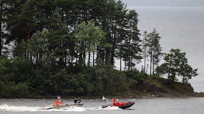 Rescuers search the waters of Utoya island in July 2011.
