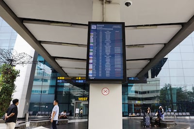 A screen displays arrivals at Terminal 3 at Soekarno-Hatta International Airport after it reopened following the eruption of Mount Anak Krakatau. Reuters