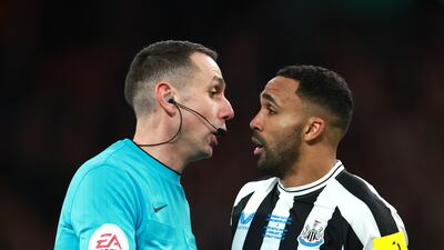 Callum Wilson of Newcastle United is spoken to by referee David Coote. Getty