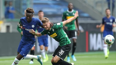 Abraham of Chelsea battles for possession with Nico Elvedi of Borussia Monchengladbach.
