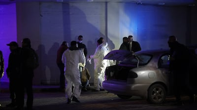 A car belonging to the militants is inspected by anti-terrorism police in Ramtha, north-western Jordan, on Tuesday. Getty Images