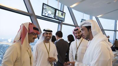 Sheikh Mansour bin Zayed, Deputy Prime Minister and Minister of Presidential Affairs, right, Suhail bin Mohammed Faraj Faris Al Mazrouei, Minister of Energy, second left, and Prince Alwaleed bin Talal bin Abdulaziz Al Saud, Chairman of the Kingdom Holding Company, left, attend the final day of the 2014 Formula 1 Etihad Airways Abu Dhabi Grand Prix at Yas Marina Circuit. Ryan Carter / Crown Prince Court — Abu Dhabi