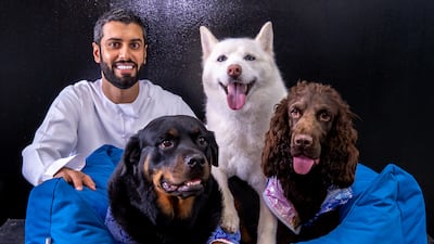 Posh Pets owner Mansoor Al Hammadi poses with his dogs Leila, Luna, and Gucci.