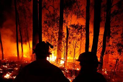 Crews monitor fires in Australia. Darrian Traynor / Getty