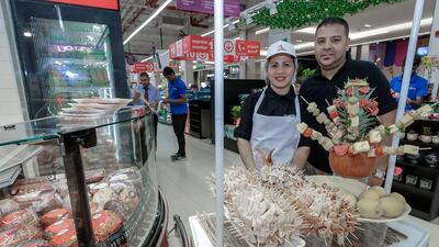 Carrefour staff pose at the bakery. Victor Besa / The National