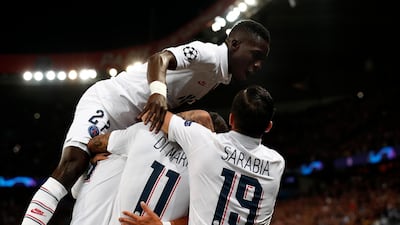 Angel Di Maria of Paris Saint-Germain celebrates with Abdou Diallo and Pablo Sarabia after scoring the first goal in a 3-0 win over Real Madrid at the Parc des Princes. EPA