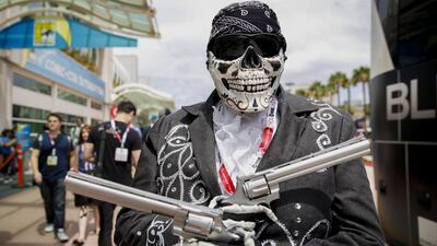 An attendee dressed as Activision Blizzard Inc’s Call of Duty character Death Mariachi stands for a photograph during the Comic-Con International convention. Patrick T Fallon / Bloomberg
