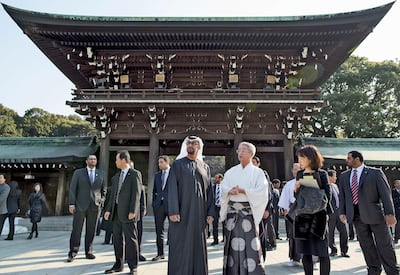President Sheikh Mohamed bin Zayed, Crown Prince of Abu Dhabi at the time, speaks with Vice-Priest of Meiji Jingu, Shigehiro Miyazaki, while touring the Shinto shrine at Yoyogi park during an official visit to Japan in 2014. Photo: Crown Prince Court