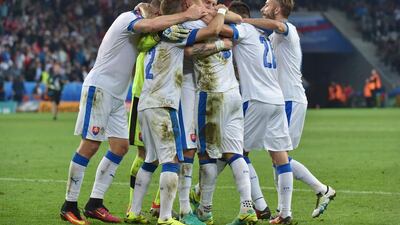 Russia supporters hold a flare during the Euro 2016 group B football match between Russia and Slovakia at the Pierre-Mauroy Stadium in Villeneuve-d’Ascq, near Lille, on June 15, 2016. / AFP / PHILIPPE HUGUE