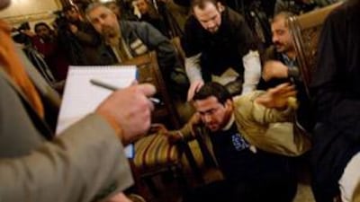 The Iraqi journalist, Muntazer al-Zaidi, taken to the ground after throwing his shoes at then US president George W Bush, on Dec 14 2008.