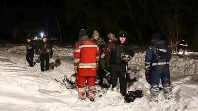 RMES employees and Russian police officers work at the scene of a AN-148 plane crash in Stepanovskoye village, about 40 kilometres from the Domodedovo airport, Russia. Russian Ministry for Emergency Situations photo via AP