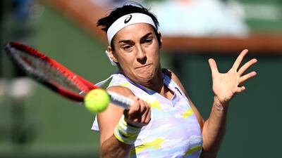 Caroline Garcia hits a shot against Emma Raducanu. Reuters