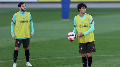 Portugal's Bernardo Silva, left, and Joao Felix train for their World Cup qualifier against Serbia. EPA