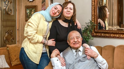 The writer with her parents, Maha and Mazen, at their home in Abu Dhabi. Victor Besa / The National