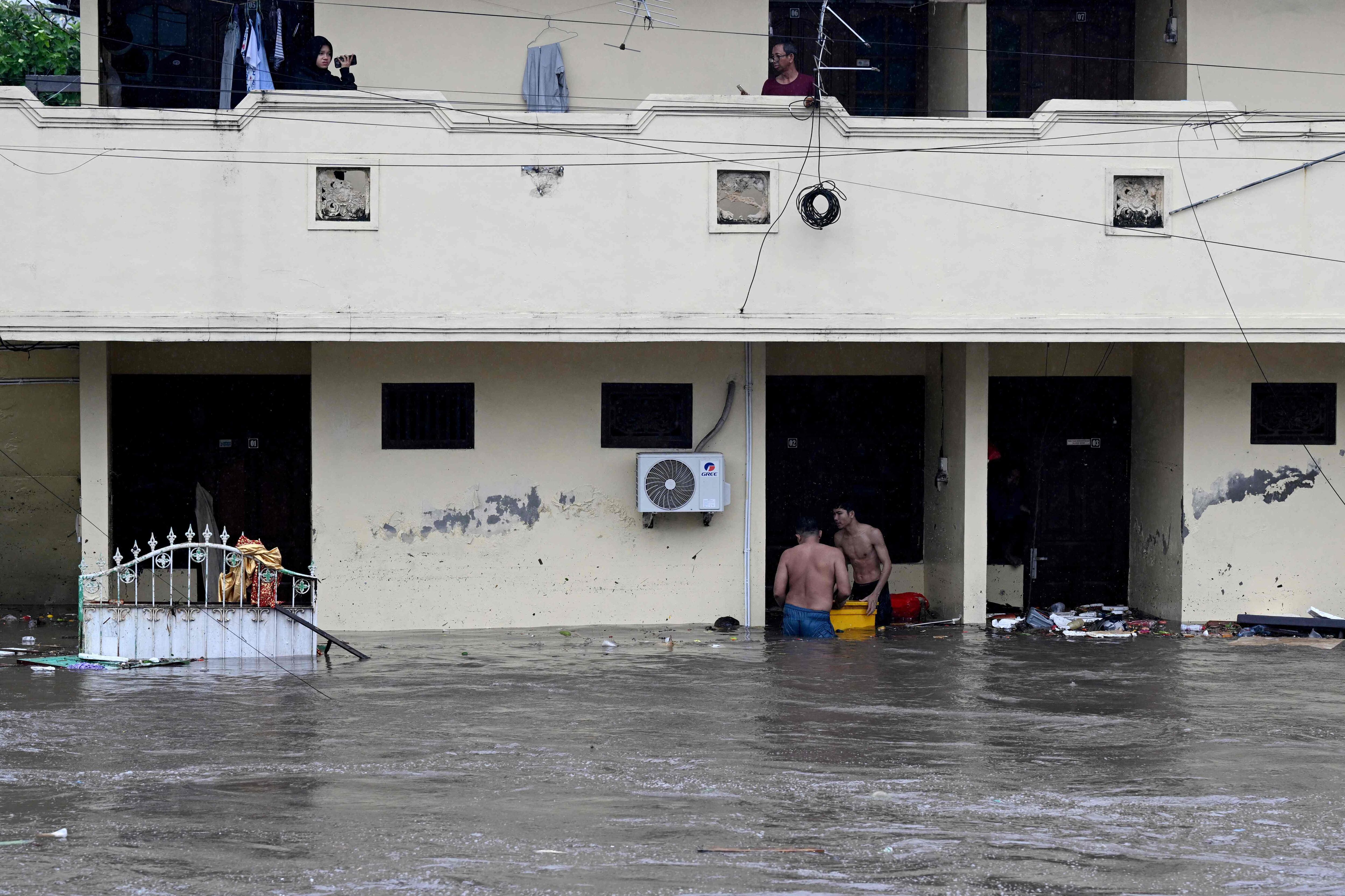 Rescuers search for the missing after Bali flash floods leave at least ...