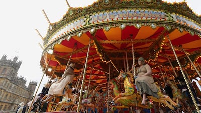Visitors attend a 1920s themed event at Highclere Castle, near Newbury, west of London, on September 7, 2019, ahead of the world premiere of the Downton Abbey film. AFP