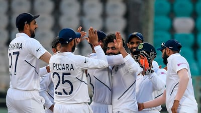 India's Ravindra Jadeja, centre, picked up the wicket of South Africa opener Dean Elgar. AFP